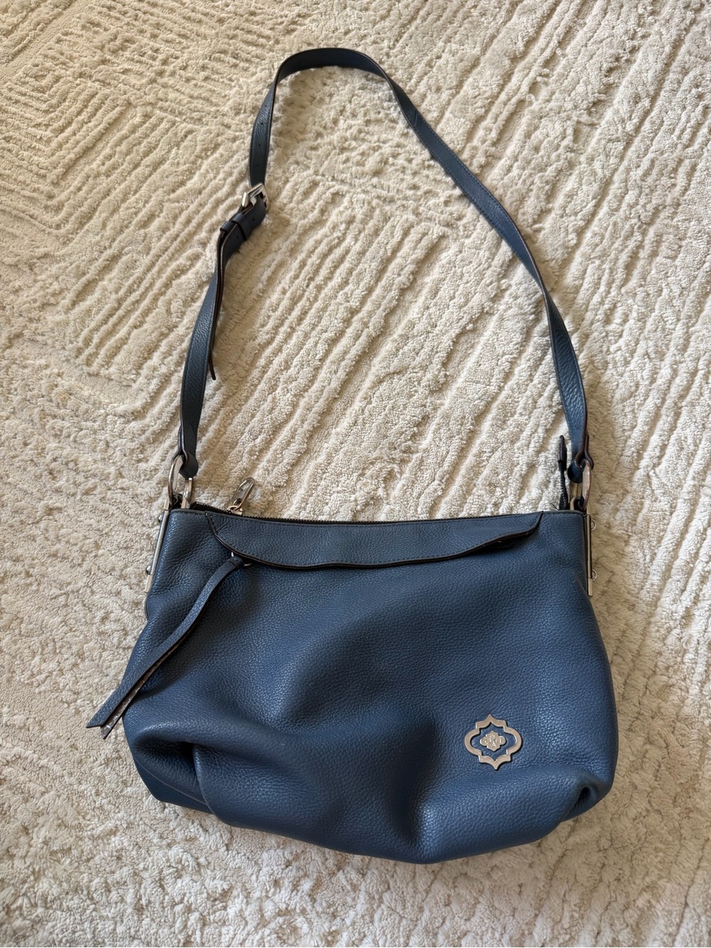 Oryany Blue Leather Women’s Crossbody Shoulder Bag with Decorative Emblem